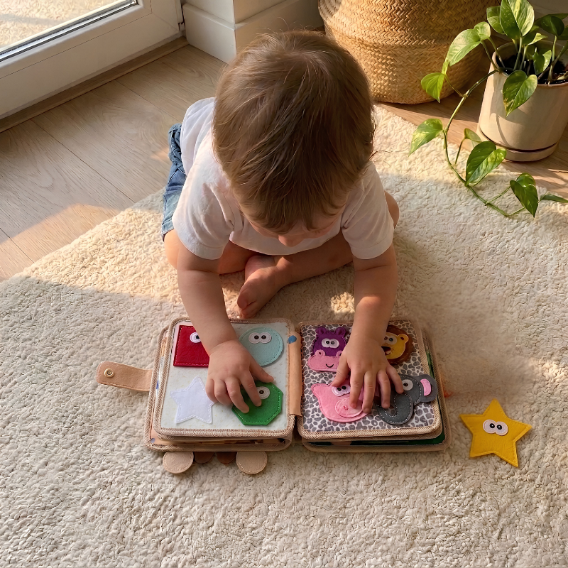 The giraffe busy book being used at home